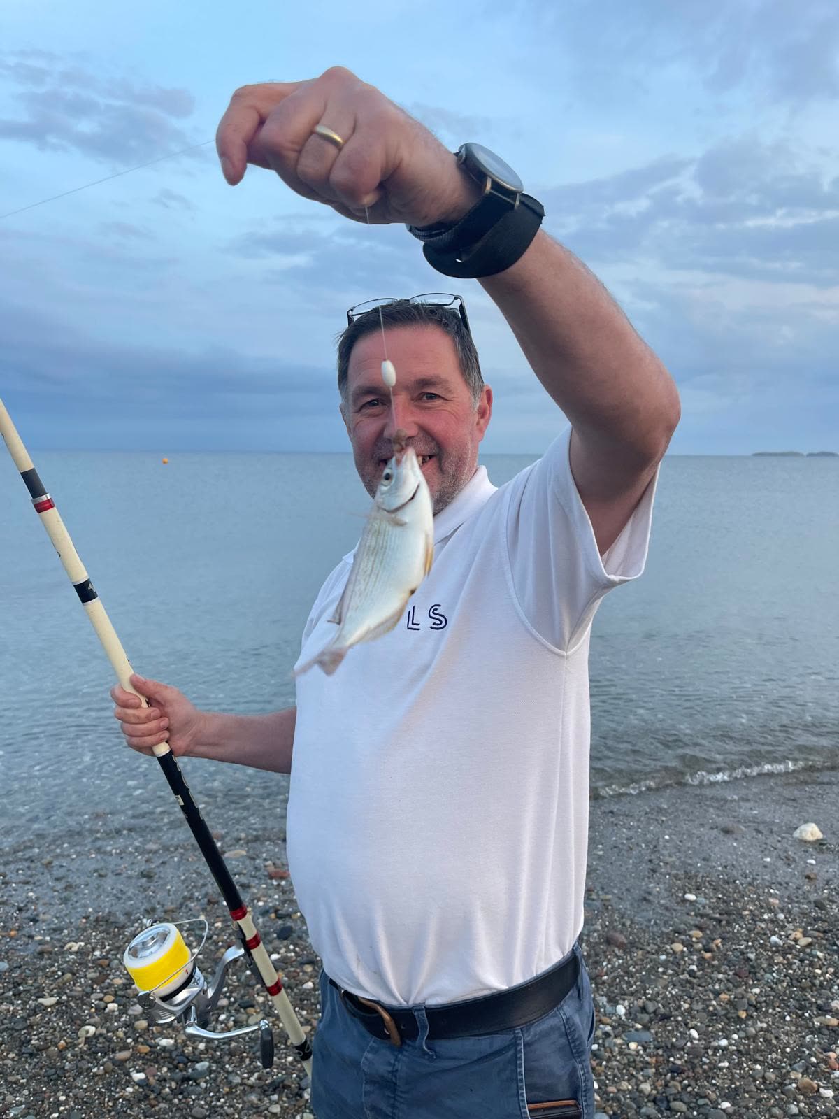 A small fish carefully unhooked before going straight back